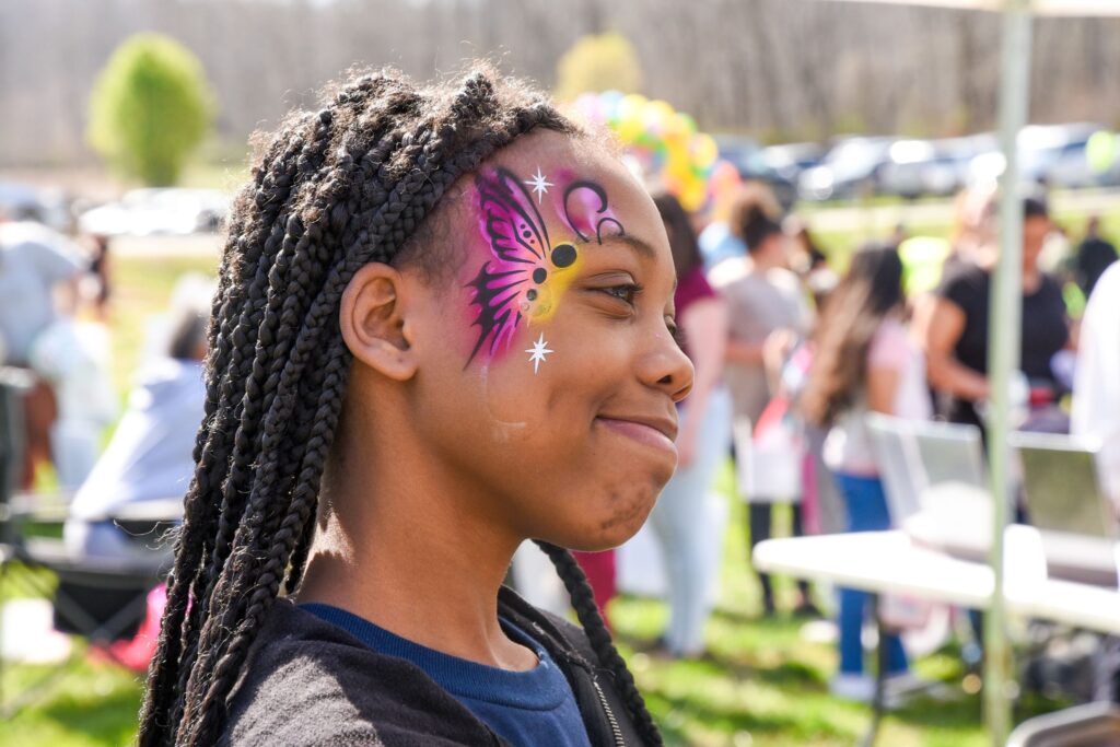 a girl with her face painted