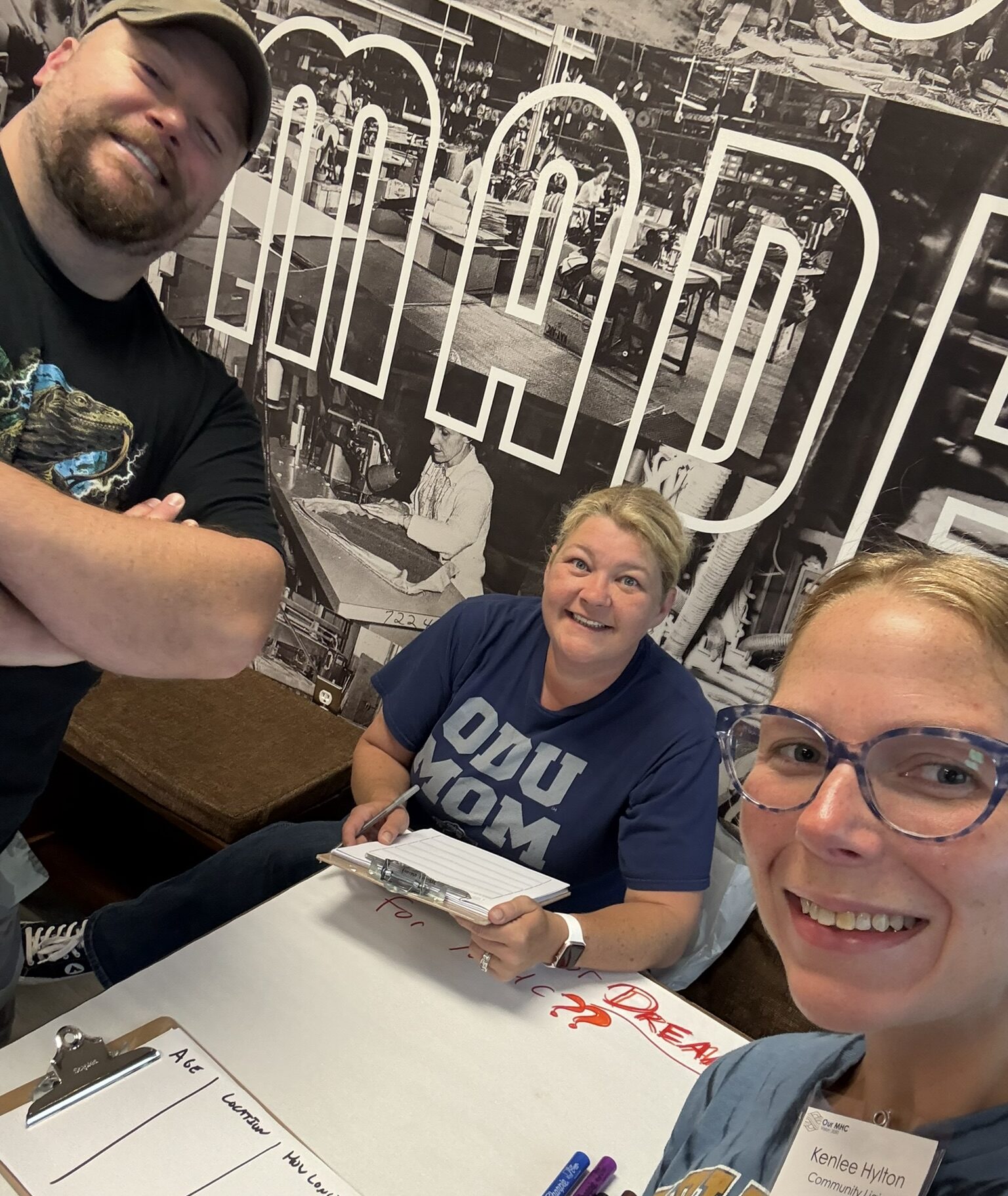Christopher, Kim, and Kenlee gathering community feedback at Factory Roast in Stanleytown
